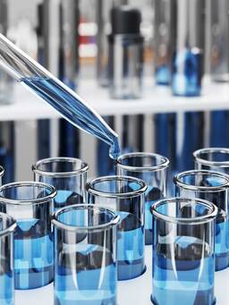 Blue chemical solution dripping into test tube. scientific research or examination. 3D rendering